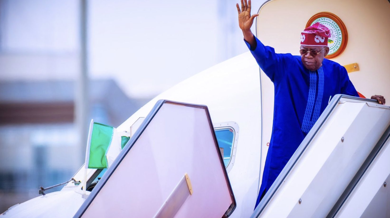Tinubu waving
