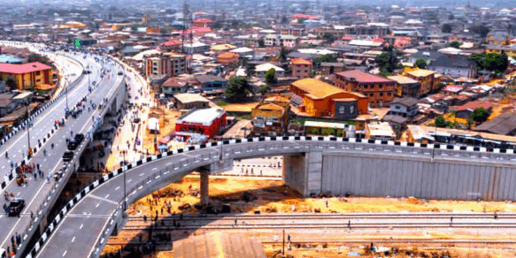 Truck Falls Off Pen Cinema Flyover, One Injured in Agege