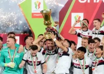 Photo of Bologna players celebrating their 1-0 Italian Cup Triumph Over AC Milan