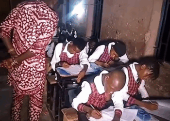 Photo of students in Taraba State writing WAEC exams late Into the night