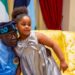 Photo President Tinubu hugging a child