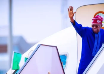 Tinubu boarding an airplane