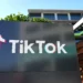 The TikTok logo is displayed on signage