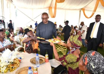 Photo of Peter Obi Serving Food
