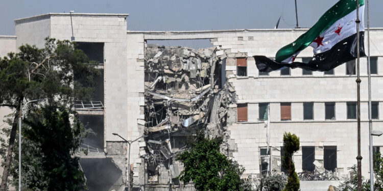 A picture shows a view of the damage following Israeli strikes on the Syrian army and defence ministry headquarters in Damascus on July 16, 2025