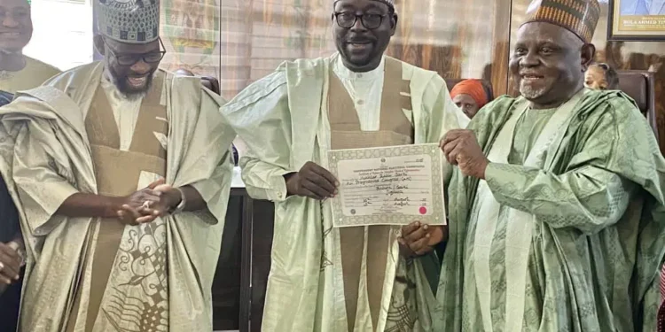 Senators-elect and members-elect of the House of Representatives of the by-elections receive Certificate of Return at the INEC headquarters on Thursday. Photo: INEC