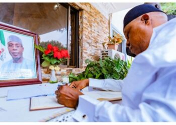 Photo of Vice President Kashim Shettima signs a condolence register in honour of former Minister of Agriculture and Rural Development, Audu Ogbeh on August 11, 2025.