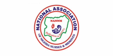 Nigerian Nurses Dispute Minister’s Claim of Strike Suspension The logo of the National Association of Nigerian Nurses and Midwives, Federal Health Institutions sector.