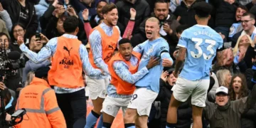 Manchester City Crush Manchester United 3-0 in Derby Showdown Manchester City players celebrating