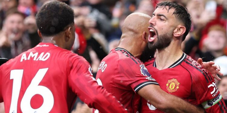 Manchester United players celebrating a goal