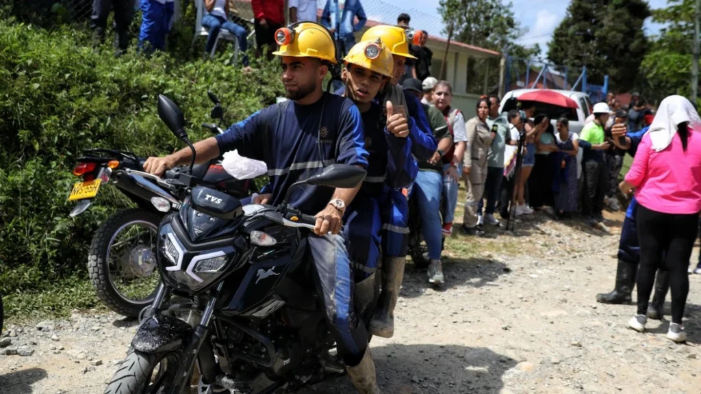 miners ride off on a motorcycle after they were rescued from a gold mine 245625560 16x9 0
