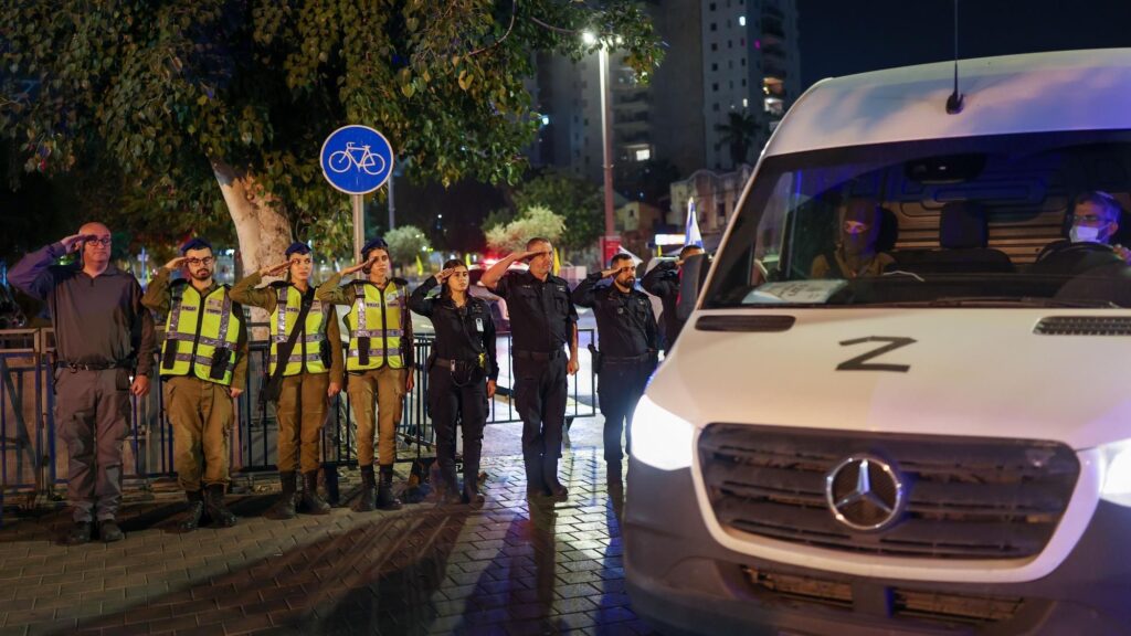 Officers salute convoy as hostages' bodies return to Israel