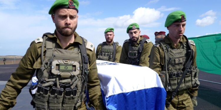 Israeli officers salute convoy as hostages' bodies return to Israel