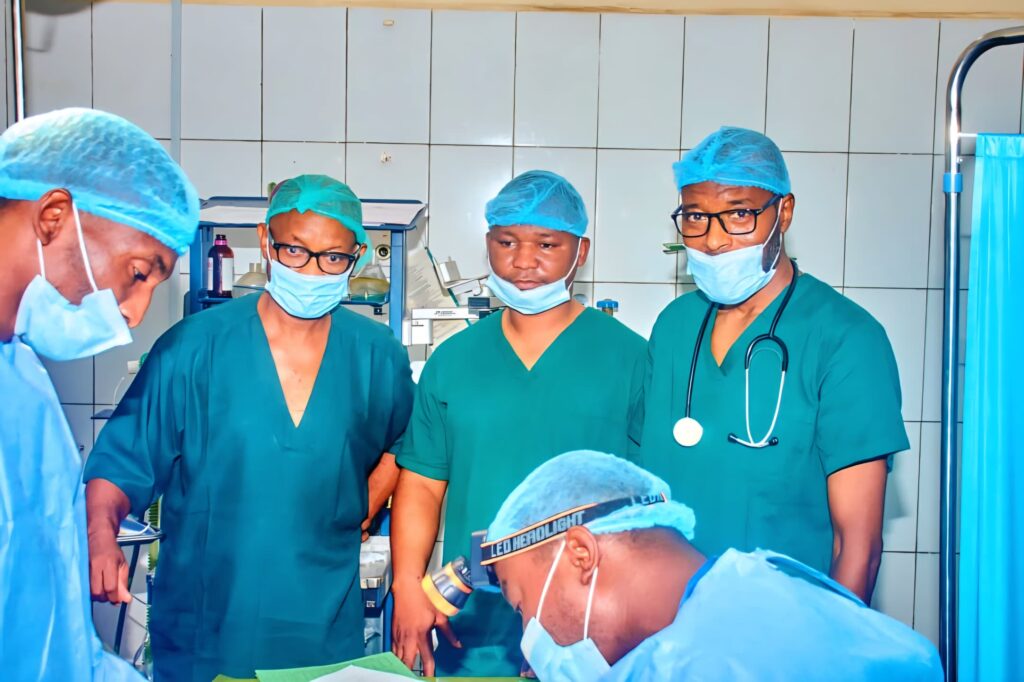 Doctors operating on a patient during the medical outreach.
