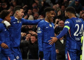 Chelsea’s Brazilian midfielder #41 Estevao (C) celebrates with teammates after scoring their second goal during the UEFA Champions League league-phase football match between Chelsea and Barcelona at Stamford Bridge in London on November 25, 2025.