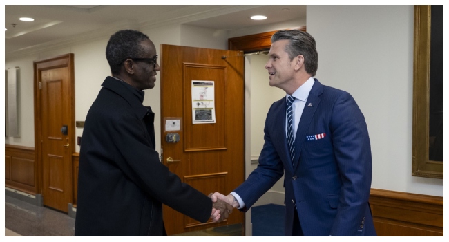 United States Defense Secretary, Pete Hegseth, greets Nigeria’s National Security Adviser, Nuhu Ribadu.