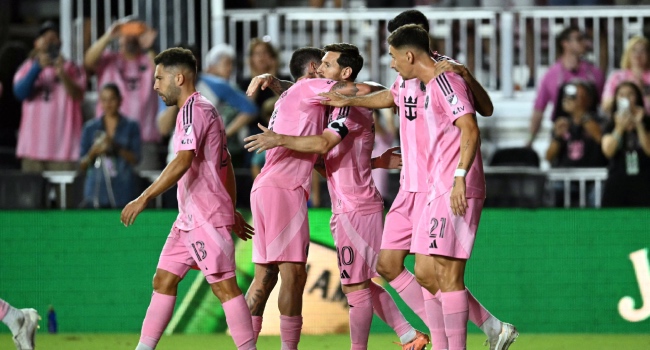 Lionel Messi celebrates with teammates