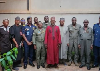 Yusuf Tuggar, meets with the 11 Nigerian Air Force personnel who were briefly detained after their aircraft made an emergency landing in Burkina Faso