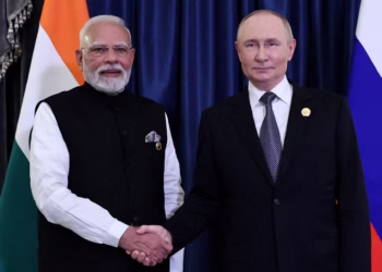Russia’s President Vladimir Putin shakes hands with India’s Prime Minister Narendra Modi.