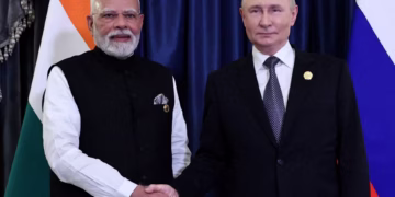 Russia’s President Vladimir Putin shakes hands with India’s Prime Minister Narendra Modi.