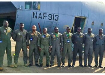 The NAF aircraft and crew members.