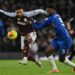 Aston Villa's English striker, Ollie Watkins (L) clashes with Chelsea's French defender, Benoit Badiashile, during the English Premier League football match between Chelsea and Aston Villa at Stamford Bridge.