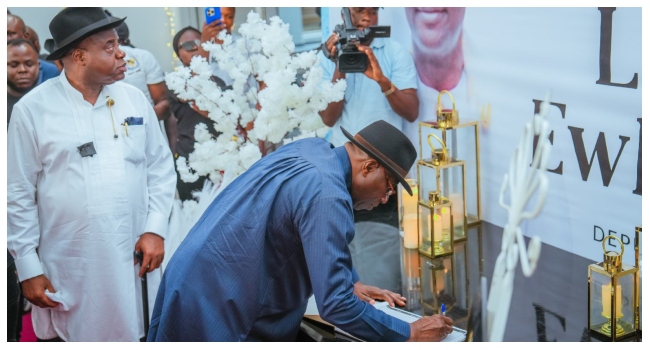 Former President Goodluck Jonathan signs a condolence register in honour of the late Bayelsa State Deputy Governor, Senator Lawrence Ewhrudjakpo.