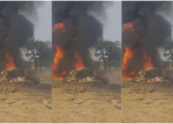 A resident of the community views the burning air force jet that crashed.