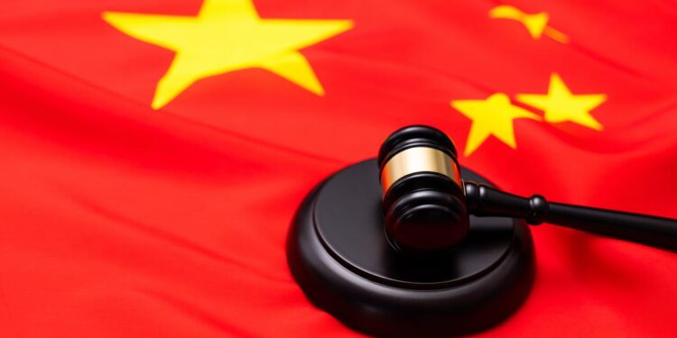 Photo of Chinnese flag and a gavel