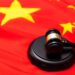 Photo of Chinnese flag and a gavel