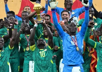 Senegal players celebrating after beating Morocco 1-0 to win the Africa Cup of Nations final match