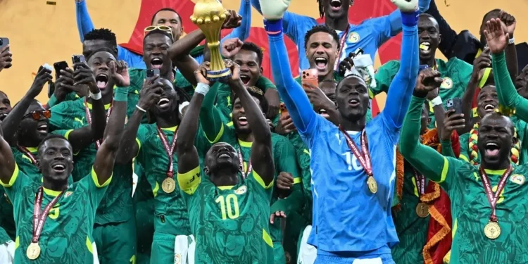 Senegal players celebrating after beating Morocco 1-0 to win the Africa Cup of Nations final match