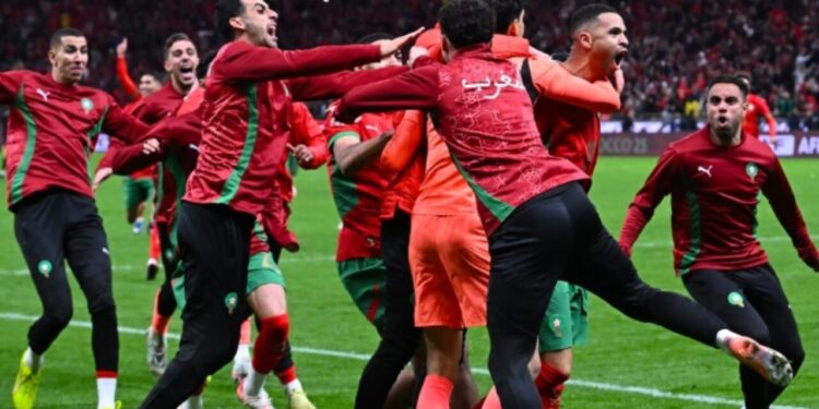 Morocco’s players celebrate after winning the Africa Cup of Nations (CAN) semi-final football match between Nigeria and Morocco at the Prince Moulay Abdellah stadium in Rabat.