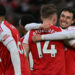Arsenal players celebrating a goal