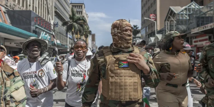 Members of Operation Dududla join members of March and March Movement during a national campaign protest in Durban.