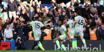 Manchester City players celebrating a goal