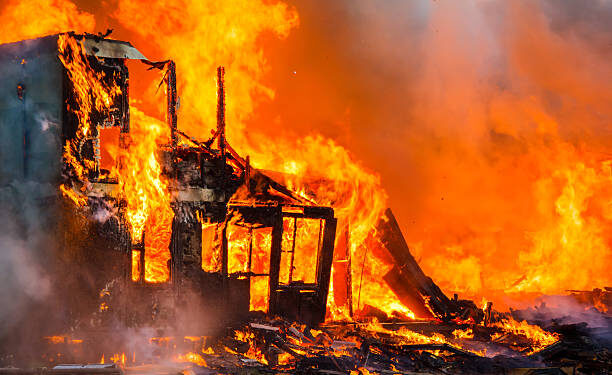 Fire Guts Nigerian Bank Burning old wooden house